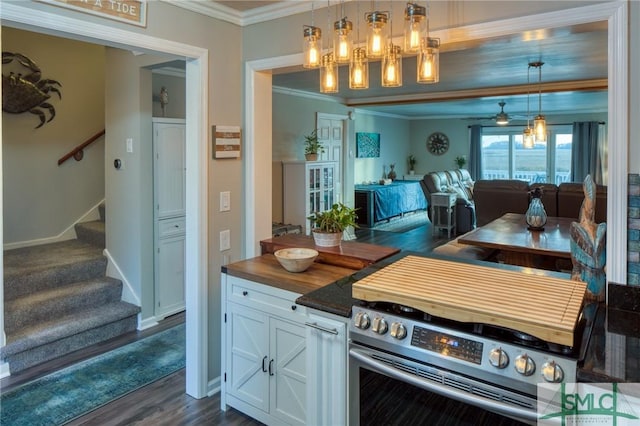 kitchen featuring white cabinetry, dark wood-type flooring, pendant lighting, and crown molding