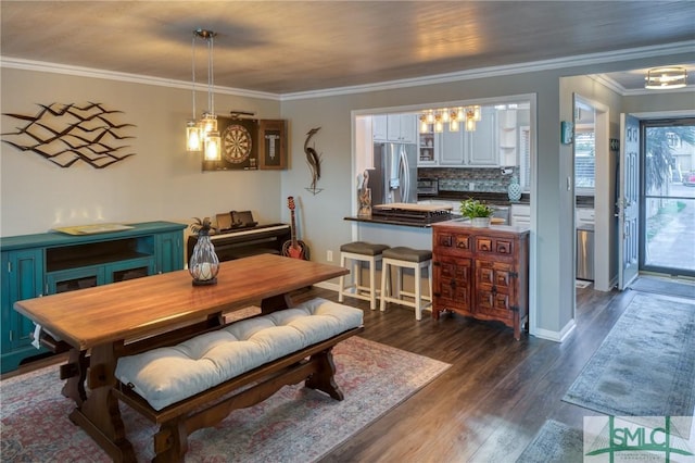 dining area featuring crown molding and dark hardwood / wood-style flooring