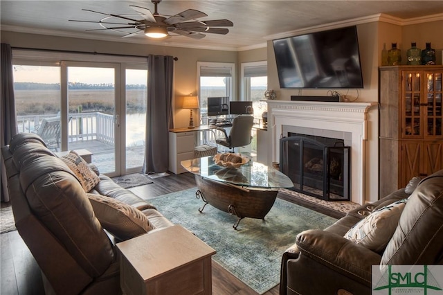 living room featuring crown molding, dark hardwood / wood-style floors, and ceiling fan