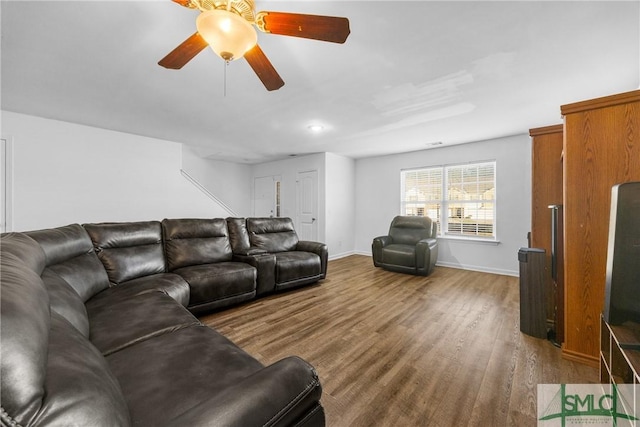 living room with hardwood / wood-style floors and ceiling fan