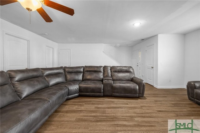 living room with hardwood / wood-style floors and ceiling fan