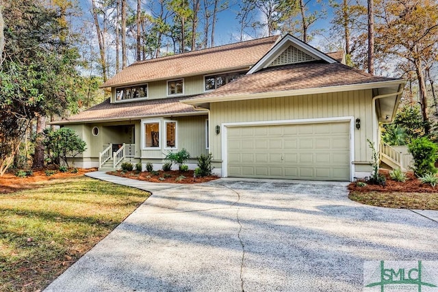 view of front facade with a garage and a front lawn