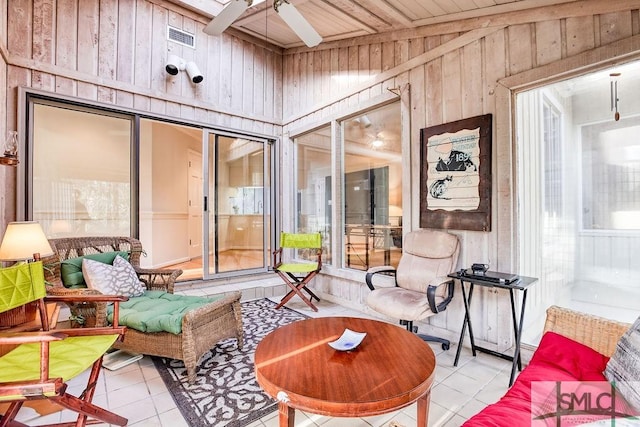 sunroom with ceiling fan