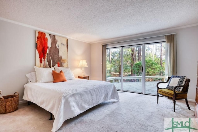 bedroom featuring access to exterior, ornamental molding, a textured ceiling, and carpet flooring