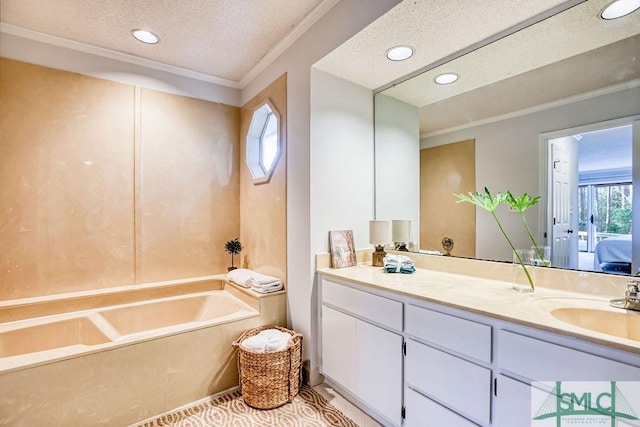 bathroom with crown molding, vanity, a bathtub, and a textured ceiling