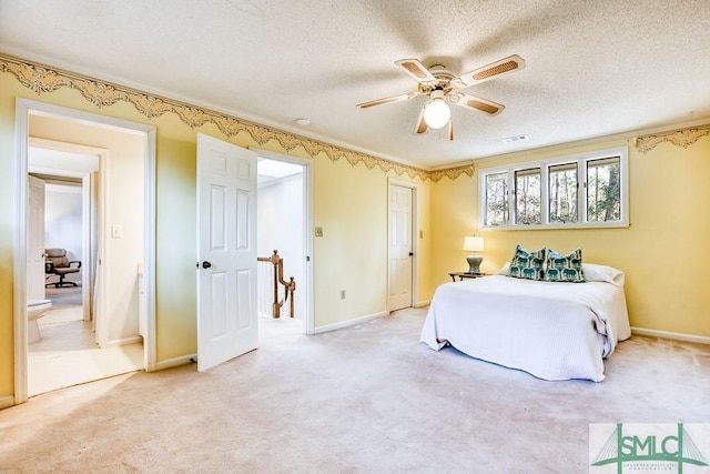 bedroom featuring ceiling fan, a textured ceiling, and carpet flooring