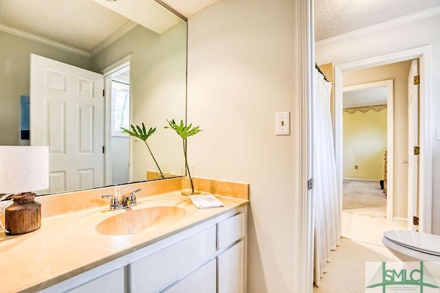 bathroom with vanity and ornamental molding