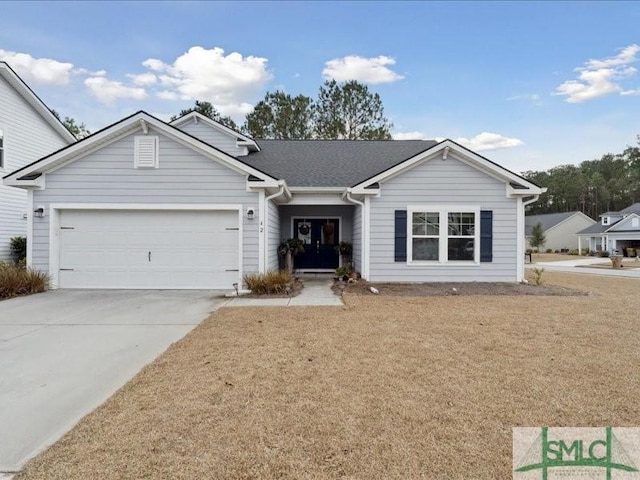 ranch-style house with a garage and a front yard