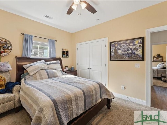 bedroom featuring ceiling fan, a closet, and carpet