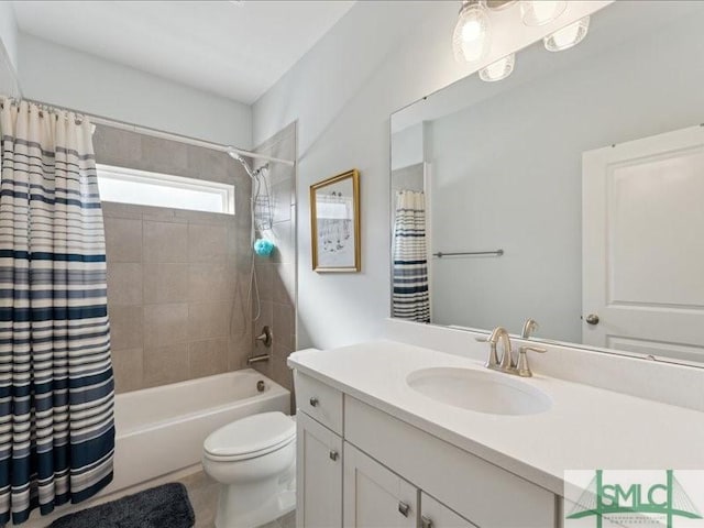 full bathroom featuring vanity, shower / tub combo, and toilet