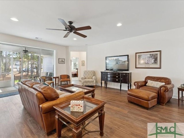 living room featuring hardwood / wood-style flooring and ceiling fan