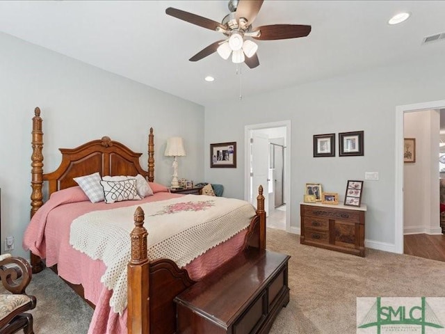 bedroom with light carpet and ceiling fan