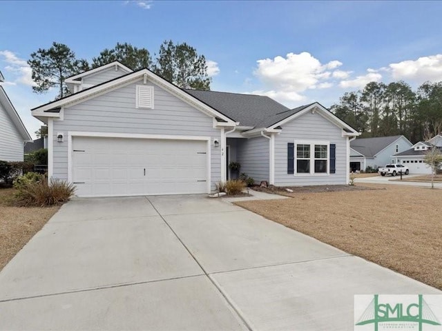 single story home featuring a garage and a front lawn