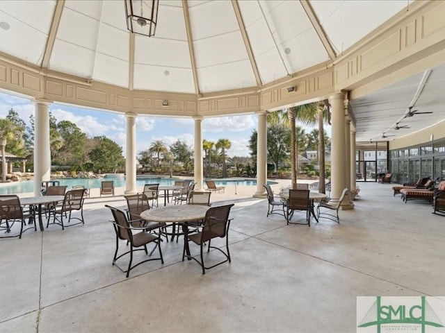 view of patio / terrace featuring a community pool and a gazebo