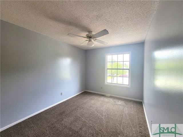 spare room featuring carpet floors, a textured ceiling, and ceiling fan