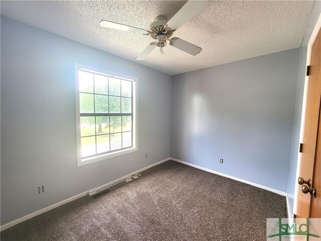 unfurnished room with ceiling fan, carpet floors, and a textured ceiling