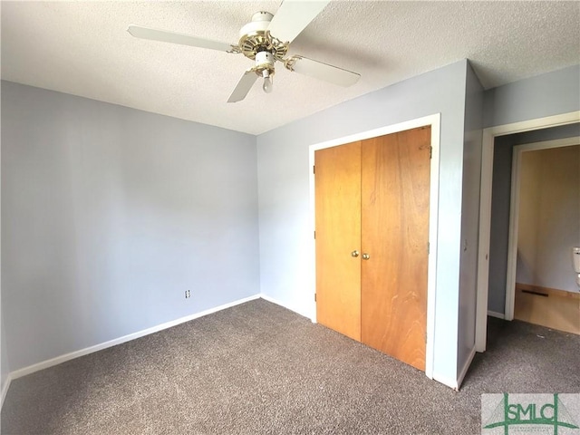 unfurnished bedroom featuring ceiling fan, carpet, and a textured ceiling