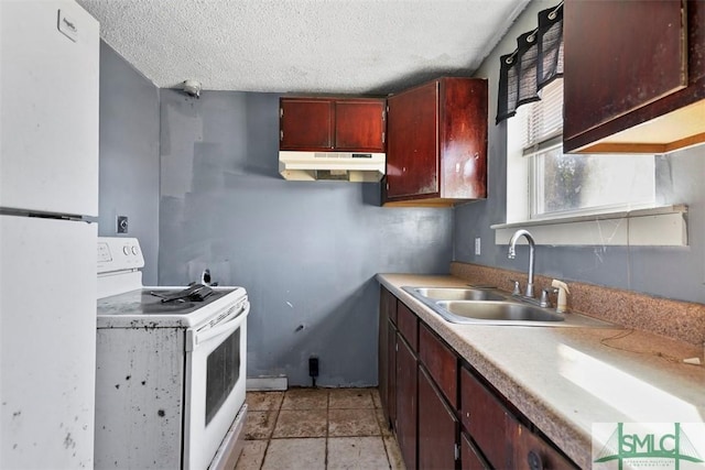 kitchen with sink, a textured ceiling, and white appliances