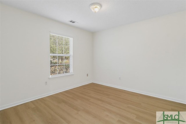 unfurnished room featuring light wood-type flooring