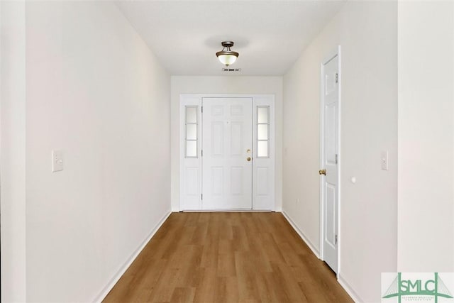 entryway with light hardwood / wood-style flooring