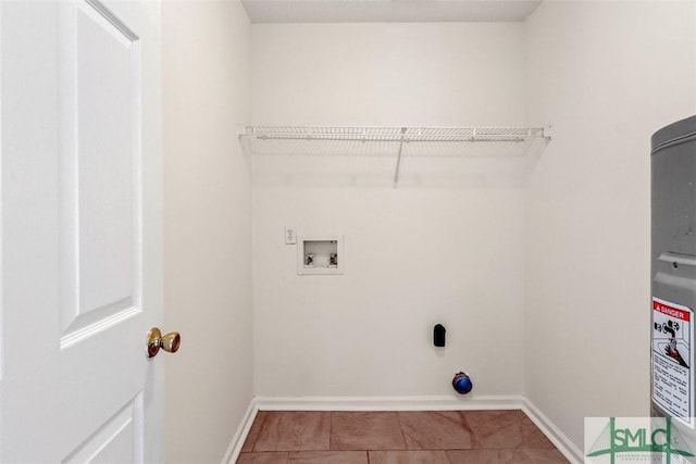 laundry room with washer hookup and tile patterned floors