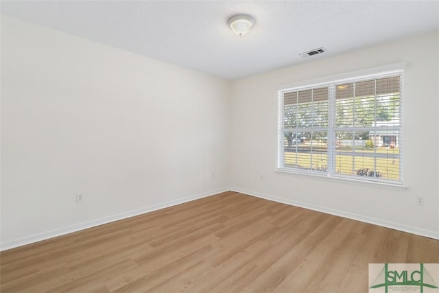 spare room featuring light wood-type flooring