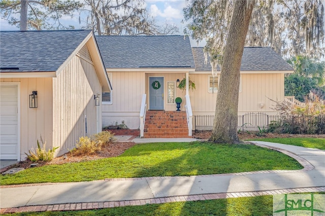 view of front facade with a garage and a front yard