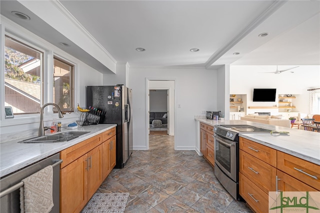 kitchen with sink, crown molding, and stainless steel appliances