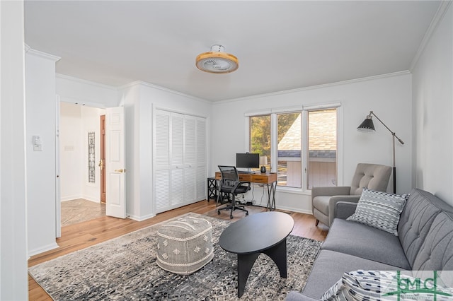 office space with wood-type flooring and ornamental molding