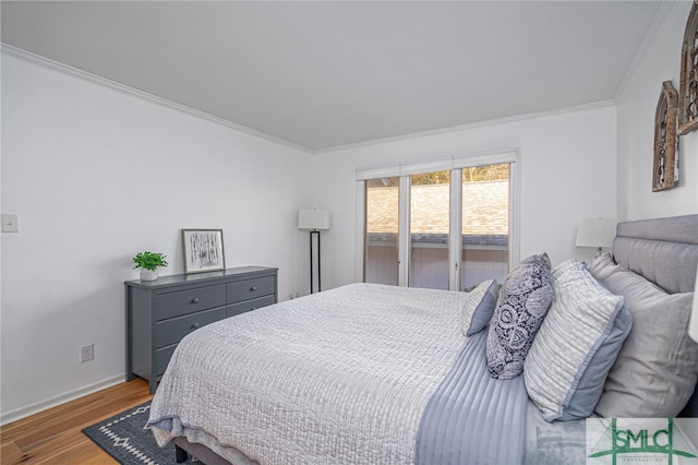 bedroom featuring crown molding and hardwood / wood-style floors