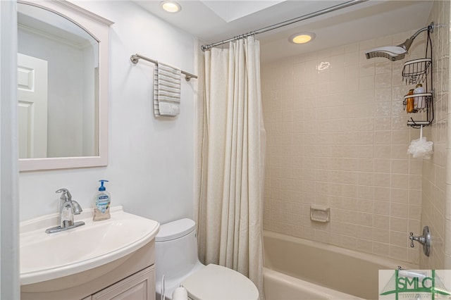 full bathroom with shower / tub combo with curtain, vanity, and toilet