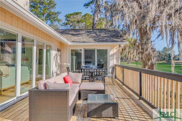 wooden terrace with outdoor lounge area