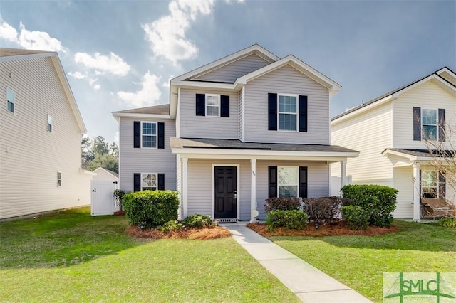 view of front of home featuring a porch and a front lawn