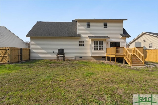 rear view of property with central AC, a deck, and a lawn