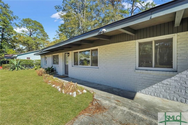 view of home's exterior with a yard