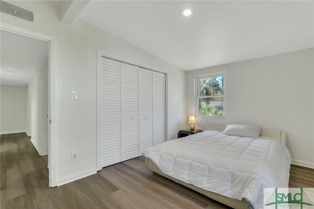 bedroom featuring hardwood / wood-style flooring and a closet