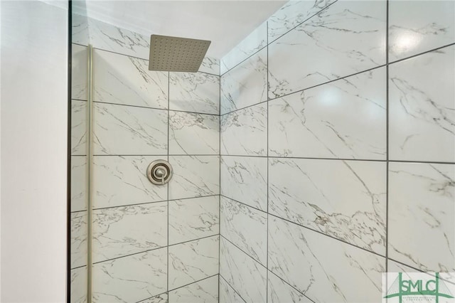 bathroom with a tile shower