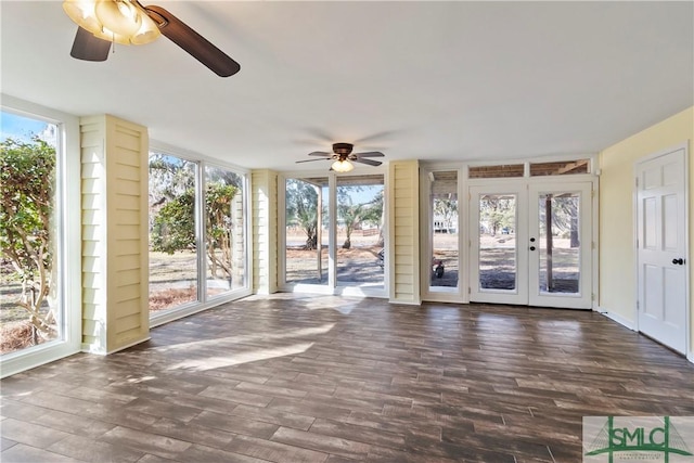 unfurnished sunroom featuring french doors and ceiling fan