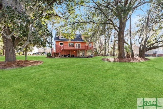 view of yard featuring a wooden deck