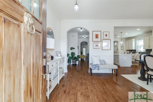 living room featuring ornamental molding and dark hardwood / wood-style floors