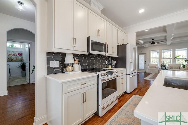 kitchen featuring white cabinetry, dark hardwood / wood-style flooring, decorative backsplash, coffered ceiling, and white appliances