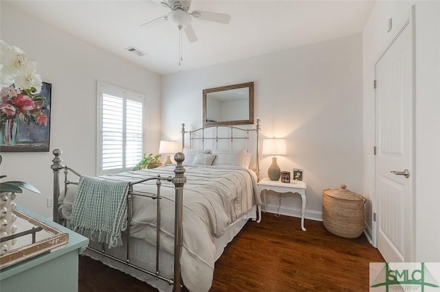 bedroom featuring ceiling fan and dark hardwood / wood-style flooring