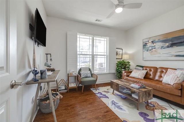 living room featuring hardwood / wood-style flooring and ceiling fan