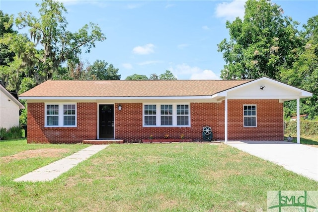 single story home with a carport and a front lawn