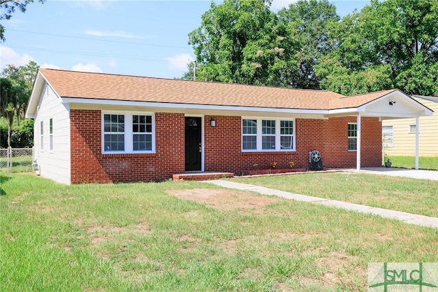 single story home featuring a front yard and a carport