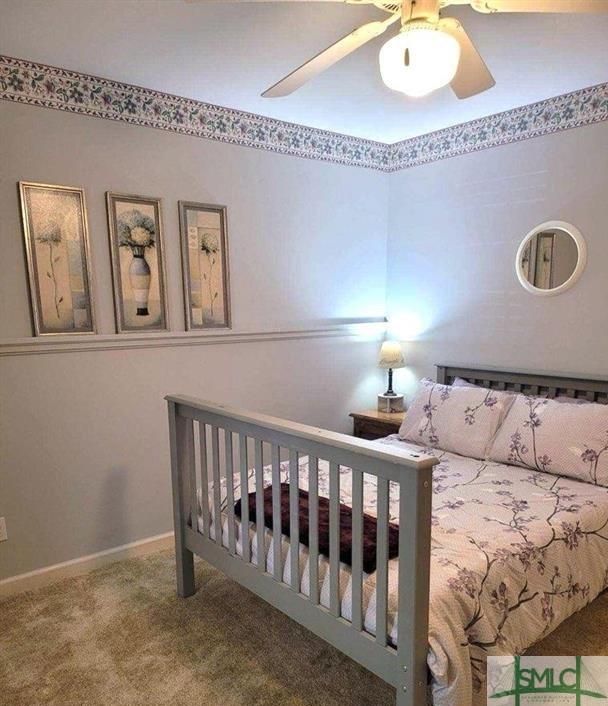 bedroom with carpet flooring and ceiling fan