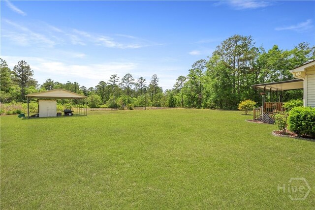 1280 Little Mccall Rd, Guyton, GA 31312 - view of grassy yard with a detached carport