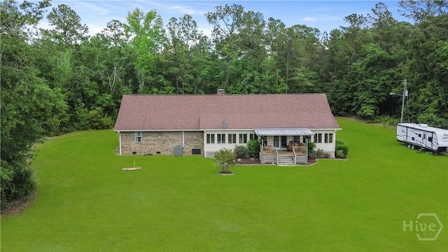 1280 Little Mccall Rd, Guyton, GA 31312 - rear view of house with a lawn, a chimney, and a wooded view