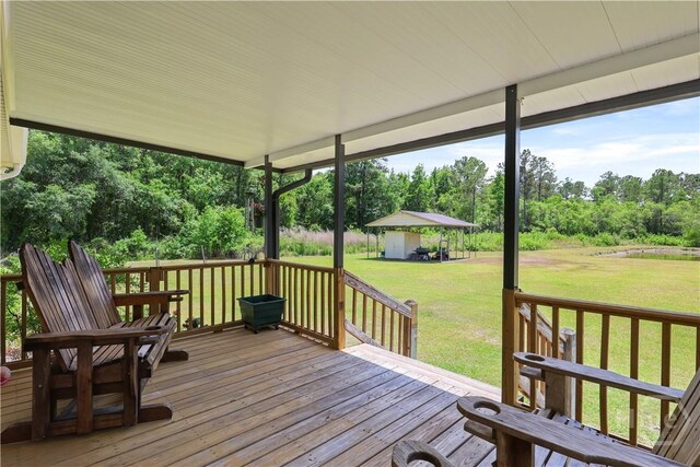 1280 Little Mccall Rd, Guyton, GA 31312 - deck featuring a lawn and view of wooded area
