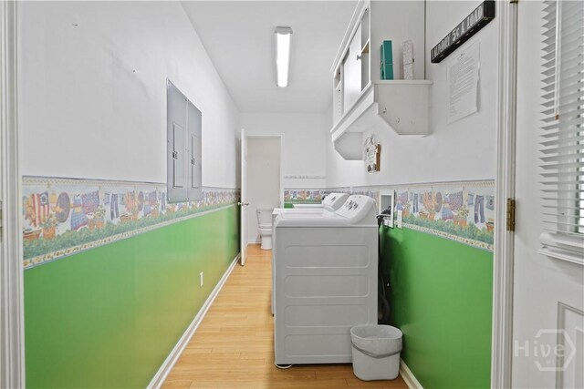 1280 Little Mccall Rd, Guyton, GA 31312 - laundry area featuring separate washer and dryer, light wood-type flooring, baseboards, and electric panel